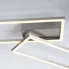 A close-up shot of a modern LED ceiling light with a brushed metal finish and a white light. Produktbild-Vorschau