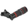 A black and red telephoto lens with a clip attachment, shown against a white background. Náhled obrázku produktu