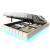A bed with its storage compartment open, revealing folded linens and blankets. The bed has LED lighting around its base. Náhľad obrázku produktu