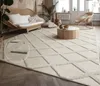 A living room with a rug, sofa, coffee table, and chair. Anteprima dell’immagine prodotto