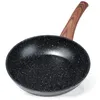 A black frying pan with a speckled pattern and a wooden handle, shown against a white background. Anteprima dell’immagine prodotto