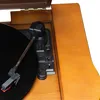 A close-up view of a record player's tonearm and turntable. Náhled obrázku produktu