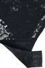 A close-up view of the crotch area of a black lace bodysuit, showing the snap closure. Produktbild-Vorschau