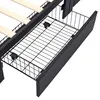 A close-up view of the underside of a bed frame, showing wooden slats and a black wire storage drawer. Podgląd zdjęcia produktu