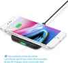A smartphone is placed on a wireless charging pad, with a cable connected to the pad. Produktbild-Vorschau