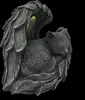 A statue of a sleeping cat curled up within angel wings. Anteprima dell’immagine prodotto