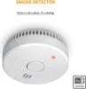 A white smoke detector mounted on a white ceiling. Produktbild-Vorschau