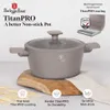 A Berlinger Haus TitanPRO non-stick pot is displayed on a wooden stand, with marketing text and icons highlighting its features. Produktbild-Vorschau