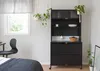 A black metal storage cabinet with a countertop and drawers is shown in a room with a window and a bed. Anteprima dell’immagine prodotto