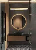 A modern bathroom with a vanity, sink, mirror, and towel warmer. Produktbild-Vorschau