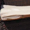 A close-up view of a cushion on a woven furniture piece, showing a partially unzipped cover. Anteprima dell’immagine prodotto