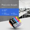 Ink cartridges in the foreground with a modern office space in the background. Produktbild-Vorschau