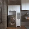 A laundry room with a washing machine and cabinets. Náhled obrázku produktu