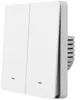 A white, two-button smart switch is shown from a side angle against a white background. Voir les images du produit