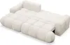 A cream-colored sofa with a tufted design, shown from a diagonal angle against a white background. Produktbild-Vorschau