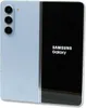 A light blue Samsung Galaxy Z Fold 5 is shown from the back and side, with the screen displaying the Samsung Galaxy logo. Produktbild-Vorschau