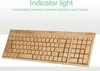 A handcrafted bamboo wireless keyboard and mouse combo is displayed against a light gray and white background. Produktbild-Vorschau