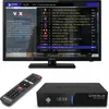 A television, a satellite receiver, and a remote control are displayed. The television screen shows a TV guide with program listings. Produktbild-Vorschau