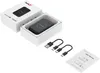 A product box and its contents, including the device, cables, and user manual. Produktbild-Vorschau