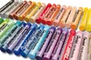 A collection of oil pastels arranged in rows. Voir les images du produit