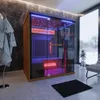 A modern bathroom with a wooden and glass infrared sauna. Produktbild-Vorschau