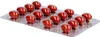 A blister pack of red capsules on a white background. Produktbild-Vorschau