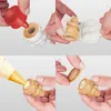 A collage of four images showing steps in decorating cookies using a baking mold. Anteprima dell’immagine prodotto