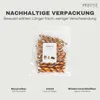 A clear plastic bag filled with dog chew sticks, with text overlays describing the packaging. Náhled obrázku produktu