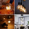 A collage of four images showcasing different vintage-style LED light bulbs and a modern kitchen setting with pendant lights. Produktbild-Vorschau