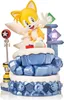 A figurine of Tails from Sonic the Hedgehog, standing on a blue, icy base with green and purple gems. Podgląd zdjęcia produktu