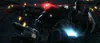 A menacing, dark-colored robot with a glowing red eye and blue lights on its chest is depicted in a dimly lit, industrial setting. Sparks and lights are visible in the background. Produktbild-Vorschau