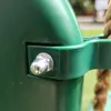 A close-up of a green plastic swing seat with a metal bolt and a rope attached. Náhled obrázku produktu