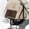 Close-up view of a beige baby stroller's adjustable backrest. Voir les images du produit