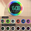 A digital alarm clock with a colorful light ring and multiple display options shown in a collage. Produktbild-Vorschau