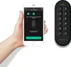 A hand holding a smartphone displaying an app interface for pairing a keypad, with the Igloohome keypad shown to the right. Voir les images du produit