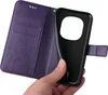 A hand holding a purple flip phone case with floral and butterfly embossing. Produktbild-Vorschau
