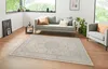A living room scene with a sofa, armchair, and a rug. Produktbild-Vorschau