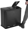 A person's foot is stepping on the pedal of a black, multi-compartment trash can. Produktbild-Vorschau