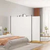 A bedroom scene with a white room divider set up to separate the bed area from another part of the room. Náhled obrázku produktu