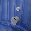 A close-up view of the interior of a blue inflatable hot tub, showing two fittings on the side wall. Podgląd zdjęcia produktu