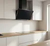 A modern kitchen with white cabinets and a black range hood. Produktbild-Vorschau