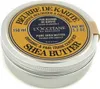 A close-up, slightly angled view of a round metal tin of L'Occitane Shea Butter. Voir les images du produit
