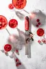 Several glasses of red liquid with raspberries and a grater on a light-colored surface. Anteprima dell’immagine prodotto