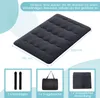 A dark gray futon mattress is shown from a diagonal top-down view, with dimensions indicated. Below the mattress are three smaller images showing accessories: two black bandages, a black tote bag, and a folded black dust cover. Náhled obrázku produktu