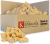 A cardboard box filled with wood wool fire starters, with some spilled in front. Produktbild-Vorschau