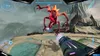 A first-person perspective of a video game, showing a player aiming a weapon at a large, red, alien-like creature in a mountainous, alien landscape. Produktbild-Vorschau