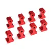 A set of eight red metal corner clamps arranged in two rows on a white background. Náhled obrázku produktu