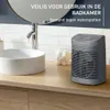 A bathroom sink counter with a heater and cotton balls. Anteprima dell’immagine prodotto