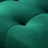 A close-up view of tufted green upholstery. Produktbild-Vorschau