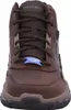 A close-up front view of a brown Skechers boot. Voir les images du produit